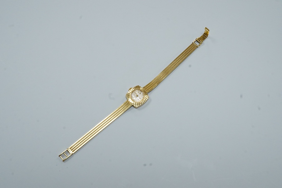 A lady's modern 18ct gold Cortebert manual wind wrist watch, with baton numerals, on 18ct gold integral strap, case diameter 18mm, overall length 17.7cm, gross weight 22 grams.